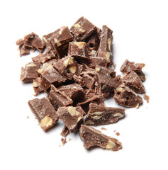 Slices of coarsely grated chocolate with nuts. White isolated background. Close-up. Top view.