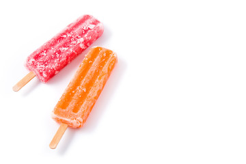 Orange and strawberry popsicles isolated on white background. Copyspace