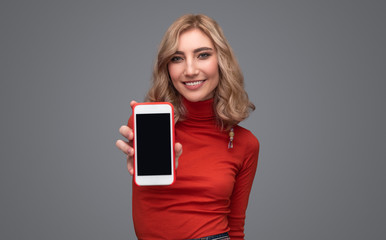 Smiling lady demonstrating smartphone