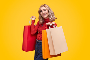 Smiling lady with shopping bags