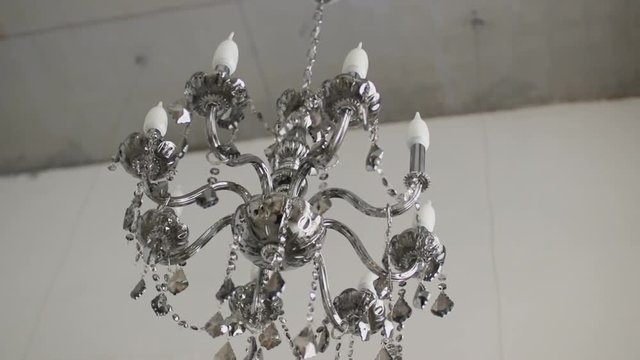 Vintage elegant chandelier in white loft space