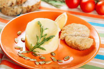 Mashed Butter Potato and Chicken Cutlet Close-up. Creamy Mash Food Serving with Pumpkin Seeds in Restaurant. Spring Healthy Dinner Meal Homemade Menu