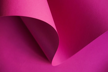 Abstraction of a design pink paper. Empty space on monochrome paper.