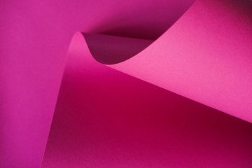 Abstraction of a design pink paper. Empty space on monochrome paper.