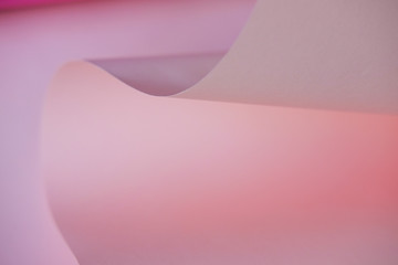 Abstraction of a design pink paper. Empty space on monochrome paper.