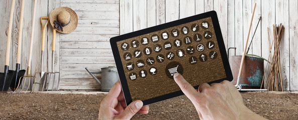 gardening equipment e-commerce concept, online shopping on digital tablet, hand pointing and touch...