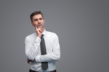 Businessman thinking and looking away