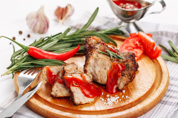 Pork Meat Tenderloin Roast with Ketchup Sauce Side View. Baked Beef Fillet Chop with Red Pepper and Rosemary. Hot Grilled Neck Steak Sliced with Herbs. Delicious Smoked Barbecue