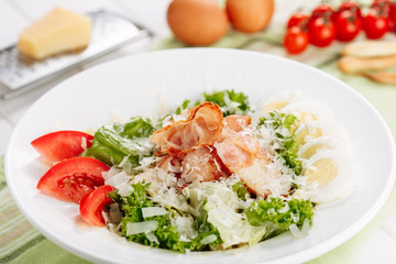 Roast Ham in Fresh Salad with Egg and Tomato Slice Side View. Delicious Prosciutto and Vegetable Plate Appetizer for Dinner. Healthy Cuisine Diet Traditional Breakfast
