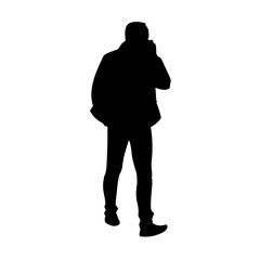 Adult man in jacket walking. Black silhouette isolated on white background. Front view. Monochrome vector illustration of man taking a walk and talking on the phone. Concept