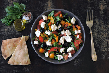 Bright vegetarian salad with vegetables, herbs and feta cheese. Keto diet. Healthy food. Middle Eastern style.