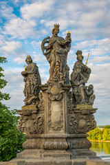 Fototapeta na wymiar Baroque Statues on the Prague Charles Bridge on a sunny day