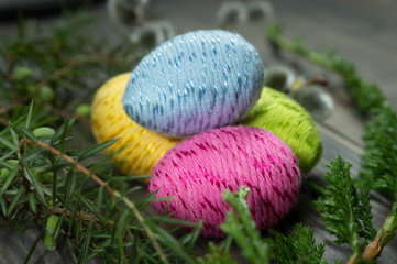 Happy Easter symbol eggs on wooden background