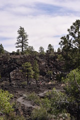 Fototapeta premium Flagstaff, AZ., U.S.A. June 5, 2018. Sunset Crater Volcano National Monument est. in 1930. Sunset Crater Volcano is a prime example of an 1,120-foot cinder volcano with substantial lava flows. 