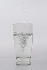 water pouring into a glass
