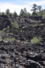 Flagstaff, AZ., U.S.A. June 5, 2018. Sunset Crater Volcano National Monument est. in 1930. Sunset Crater Volcano is a prime example of an 1,120-foot cinder volcano with substantial lava flows. 