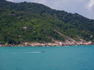 Fototapeta premium Motor boat on the surface of the sea near the island. Koh Phangan. Thailand