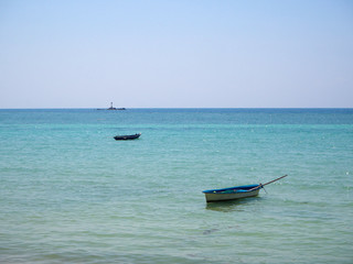 Fototapeta premium Motor boat on the surface of the sea near the island. Koh Phangan. Thailand