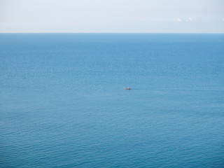 Obraz premium Motor boat on the surface of the sea near the island. Koh Phangan. Thailand