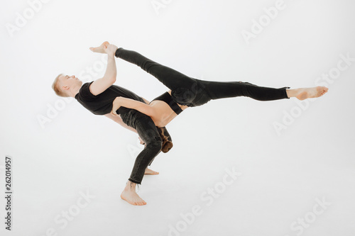 Caucasian Dancing Couple Middle Level Lift Stunt Blond Man