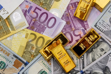 Paper money and gold ingot, close up