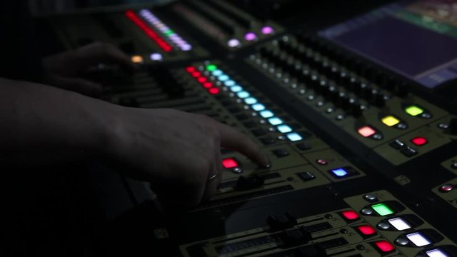 remote recordists closeup. Hand adjusts sound effects. Electric machine on table for working of sound designer or club dj at party in nightclub. Occupation for modern lifestyle, objects for listen at 