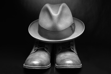 Men's shoes and hat. Rich lifestyle contcept.Dark background.Vintage and retro style.