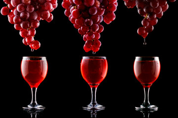 set with Italian red wine tasting and wine culture: wine glass and grape on a black background.