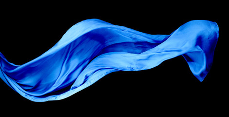Smooth elegant blue transparent cloth isolated on black background.