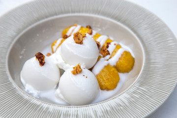 Coconut ice cream with banana in syrup