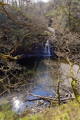 View of a waterfall on a tourist trail in the mountains of Snowdonia, Wales.