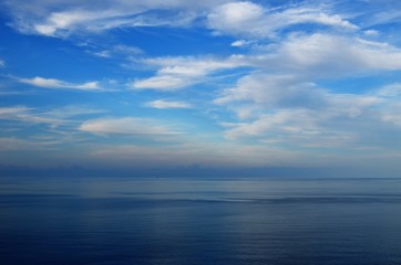 Naklejka na ściany i meble Blue sky and the ocean.