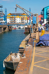 Fototapeta na wymiar Scene on the quayside at the entrance to Exmouth dock UK