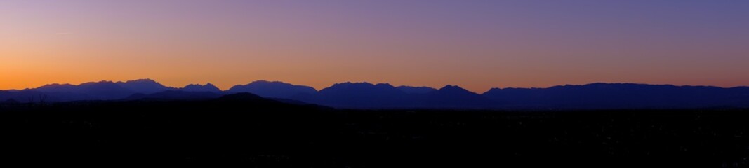 Fototapeta na wymiar Skyline during the sunset of the Mountains Alps from Vicenza, April 2019