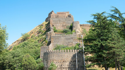 Fototapeta na wymiar Gori, Georgia - Jul 04 2018: Ruins of Gori fortress. a famous Historic site in Gori, Shida Kartli, Georgia.