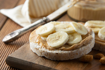 Dietary snack - Peanut butter and banana on rice cakes, healthy, dietary food.
