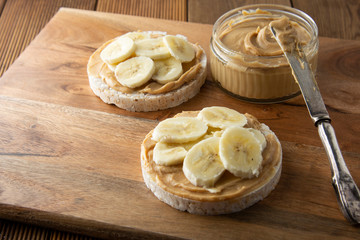 Peanut butter and banana on rice cakes, healthy, dietary food.