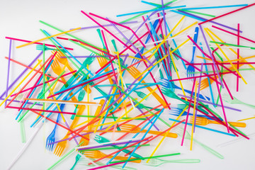 Colorful bright straws and forks being result of animal deaths