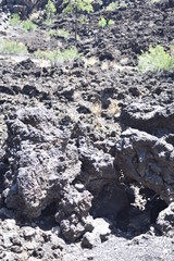 Flagstaff, AZ., U.S.A. June 5, 2018. Sunset Crater Volcano National Monument est. in 1930. Sunset Crater Volcano is a prime example of an 1,120-foot cinder volcano with substantial lava flows. 