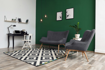 Modern living room interior stylish sofa near green wall