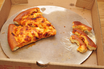 Two Slices of Buffalo Chicken Pizza in a Take Out Box