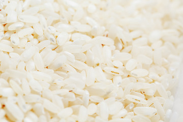White rice background and texture. Rice grain. View from above. Close-up