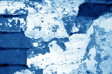 Old grungy brick wall texture in navy blue tone.