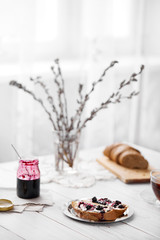 Bread with butter and blackberry jelly