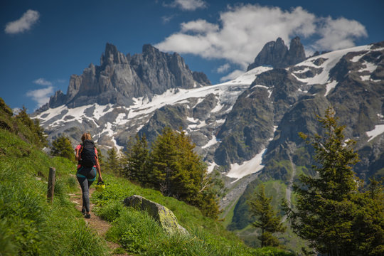 Pretty, female hiker/climber in a lovely alpine setting of Swiss Alps