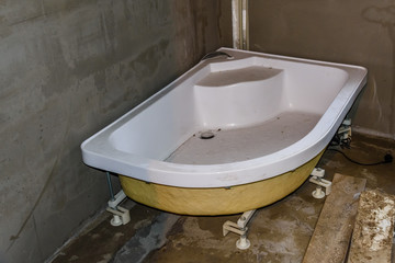 Installing of the bath in new residential building