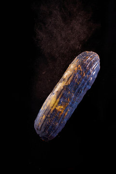 Beautiful bright eclair with blets on a dark background.