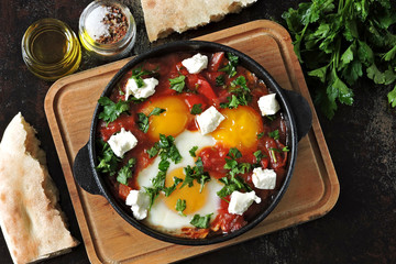 Fried eggs with vegetables and feta cheese. Shakshuka.Keto diet. Keto breakfast or snack. Middle Eastern style.