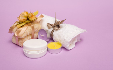 beauty set with soap on a violet background