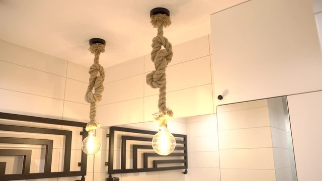Modern interior design bulbs hanging switching on/off, sliding shot